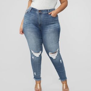 High rise stretch distressed medium wash jeans